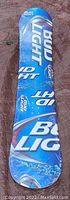 Top view of new full size snowboard with Bud Light branding, blue color, glossy finish.