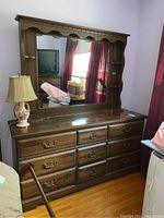 Full view of nine-drawer dresser with attached mirror hutch