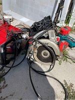 Scope of entire lot - assortment of power tools including Skilsaw, Black and Decker drill, Craftsman planer, soldering tool, and Makita power pack with batteries.