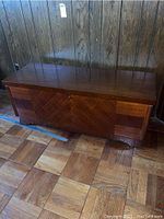 Front view of the Lane cedar chest, showing polished wood surface and parquet-style front design.