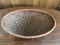 Top-down view showing intricate geometric pattern of the woven basket