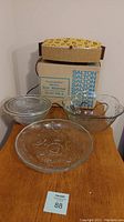 Salton Bun Warmer in box with three glass salad bowls on table