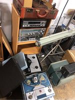 Vintage reel to reel tape recorders, Technics stereo and CD player, various stereo equipment stacked on shelving and floor