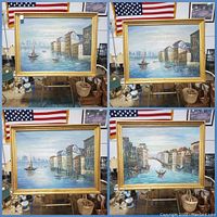 Four framed Venice canal paintings on an easel with American flag in background