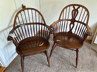 Photo showing both Windsor chairs side by side, highlighting the differences in backrest designs and the wooden finish.