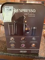 Front of sealed Nespresso VertuoPlus & Aeroccino3 box on countertop
