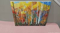 Front view of the oil painting showing entire birch forest scene with autumn colors.