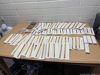 Wide view of full-size Mary Kay liner pencils arranged on table