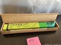 Closed cardboard box labeled 'HOHNER C-DESCANT' containing the recorder.