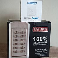 Photo of EleMake Mechanical Keyless Door Lock box with product image and Schlage Sense WiFi Adapter box on top.