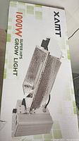 Box with 1000W Super HPS grow light showing product image and branding.
