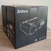 Box for one Jinhoo projector showing product illustration and brand name