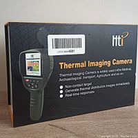 Closed HTI thermal imaging camera retail box with branding and features listed