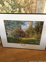 Framed print of Monet's The Parc Monceau garden scene with signature visible on bottom mat.