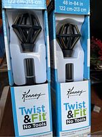 Close-up of two Kenney Twist & Fit adjustable curtain rods in original packaging showing geometric diamond-shaped finials and label indicating 48-84 inch adjustable length and no tools needed for assembly.