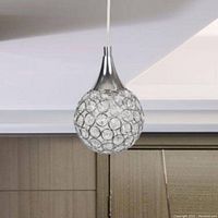 Single glass globe pendant light hanging against a ceiling and wall showing chrome fixture and clear crackle glass design.