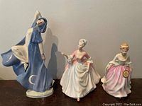 Front view of all three Royal Doulton figurines displayed side by side