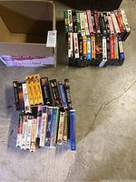 Photo showing two rows of VHS tapes alongside an empty box labeled Ruby Red.