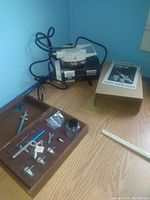 Badger Model 100 compressor, original box, accessories on wood surface