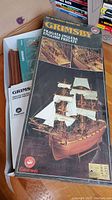 Box of the Grimsby English Frigate wooden ship model kit showing the original packaging and some parts inside the box