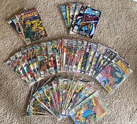 Entire collection of 49 Marvel comics arranged on carpet in protective bags