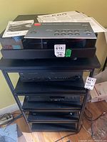 Three-tier rack holding SOTA Comet turntable, NAD amplifier and CD player