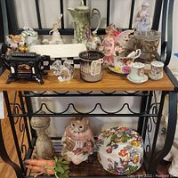 Full lot on two shelves, showing all ceramic, metal, glass items including figurines and decorative objects