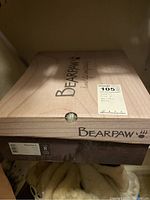 Photo of Bearpaw branded boot box showing size 8 label.