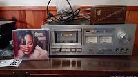 Pioneer stereo cassette tape deck with CD by Dianne Reeves and disc washer box on top
