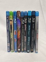 Photo showing spines of 9 Blu-ray DVDs lined up upright highlighting titles including Harry Potter series, Boxtrolls, and I Am Legend.