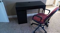 Black lightweight desk with two drawers and one cabinet under the left drawer section.