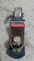 Top view of U-Haul PowerTow hitch showing the ball with 2 5/16" marking and U-Haul PowerTow label on the neck.