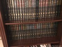 Shelves with the Britannica Great Books volumes, showing volumes 1 through 38 in dark brown bindings with gold text
