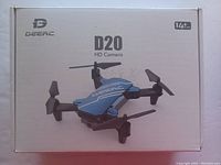 Closed retail box of Deerc D20 HD camera drone for ages 14+. White box with drone picture and branding.