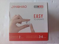 Front view of Jinghao JH-A39 hearing aids packaging showing a person holding one hearing aid and charging info.