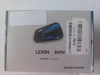 Image of Lexin B4FM Bluetooth Intercom box with product image and labels.