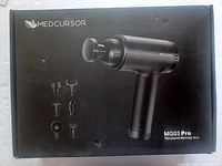 Packaged box showimg image of Medcursor MG03 Pro percussive massage gun and six interchangeable massage heads