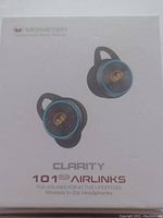 Box front showing the Monster Clarity 101 Plus Airlinks earbuds with blue rings and Monster logo, branding and product name.