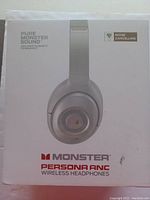 Front view of the original box for Monster Persona ANC wireless headphones showing product image, brand and features including noise cancelling.