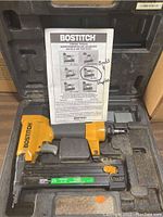 Bostitch brad and staple gun in carrying case with instructions and extra staples