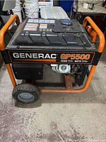 Front left side view showing Generac GP5500 label, wheels, frame