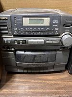 Aiwa branded stereo cassette player with AM/FM radio tuner, digital display and cassette controls.