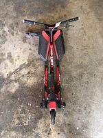 Top-down view of red and black Fiker Lift scooter showing handlebar and foot decks.