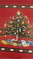 Close-up image of the Christmas tree graphic with gifts and ornaments on the tray.