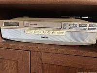 Front view of Sony Mega Bass CD Radio Player showing CD slot, control buttons, and speaker grille with Sony logo.