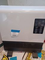 Front view of AirChoice IPH-01S heater showing white and black color scheme and control panel.