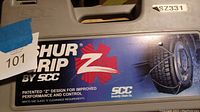 Grey carrying case with Shur Grip by SCC branding and SZ331 size label.