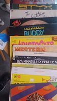 Overview of several vinyl record covers showing various genres and artists.