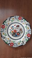 Full view of the round Coalport china plate with colorful Canton pattern, showing floral and pagoda motifs on scalloped edge.