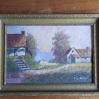 Framed landscape painting depicting rural houses, path, trees, and distant horizon. Visible signature on bottom right.